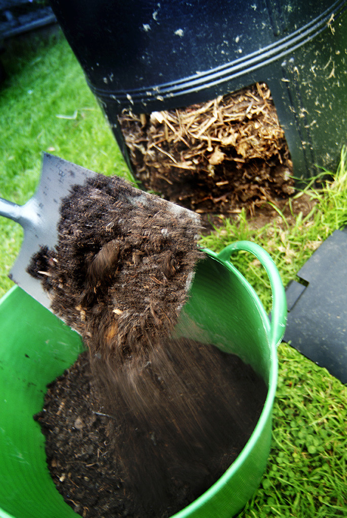 removing compost from a bin